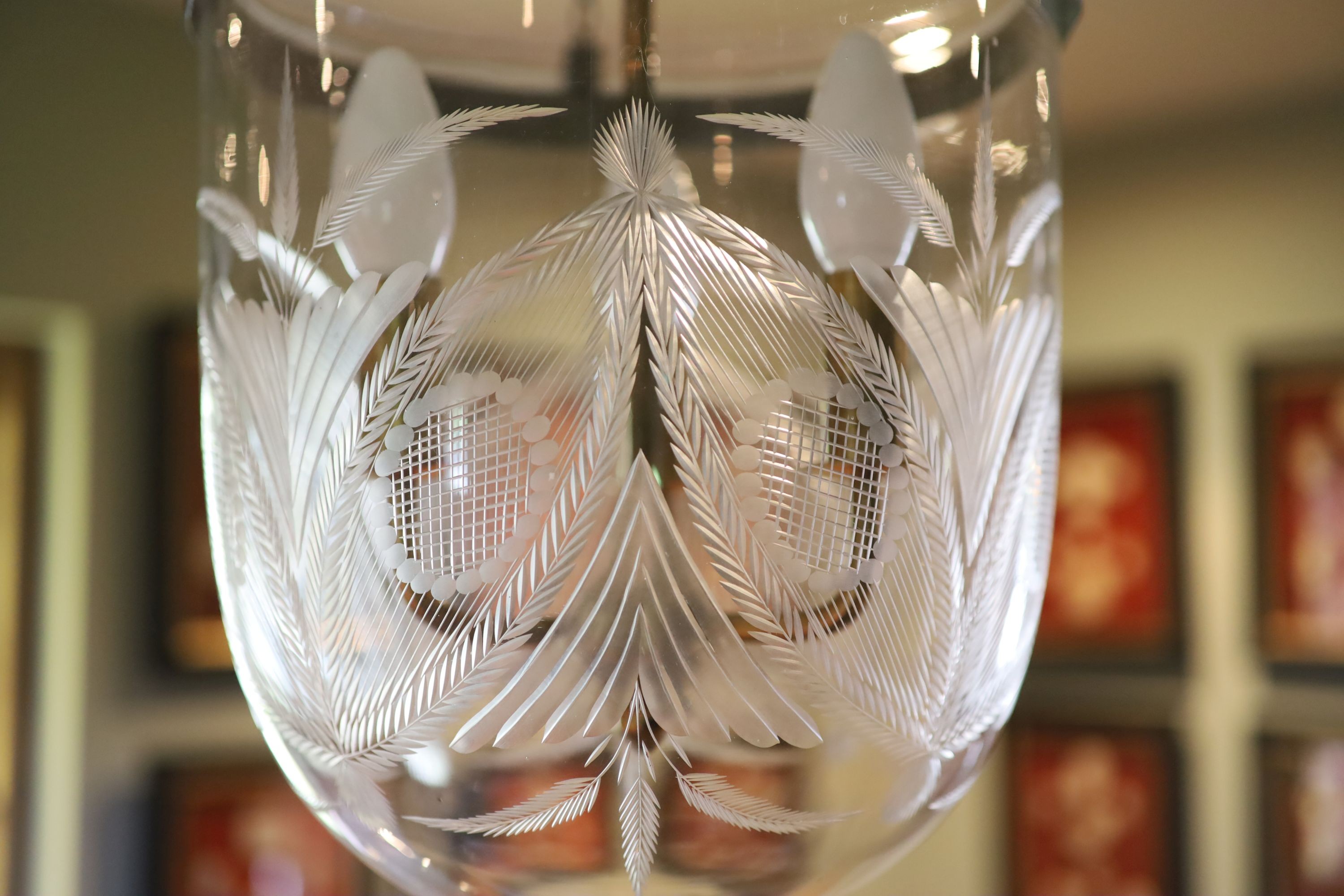 A cut and etched glass hurricane style ceiling light, height 54cm diameter 30cm, fitted for electricity